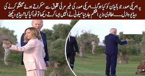 Joe Biden appears to wander off at G7 summit before being pulled back by Italian Prime Minister